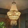 Modern Farmhouse Empire Beaded Chandelier, 3-Light Gold Transitional Tiered Boho Chandelier with Handmade Wood Beads by Uolfin