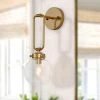 Modern Globe Wall Sconce Light Naomi 1-Light Antique Gold Dome Wall Light with Clear Glass Shade by Uolfin