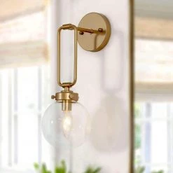 Modern Globe Wall Sconce Light Naomi 1-Light Antique Gold Dome Wall Light with Clear Glass Shade by Uolfin