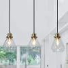 Modern Kitchen Island Chandelier 3-Light Black and Brass Height Adjustable Chandelier with Teardrop Clear Glass Shades by Uolfin