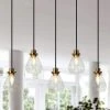 Modern Kitchen Island Chandelier 5-Light Black and Brass Linear Dining Room Chandelier with Clear Glass Shades by Uolfin