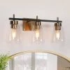 Modern Gold Bathroom Vanity Light, 22 in. 3-Light Black and Brass Gold Wall Sconce with Seeded Glass Shades by Uolfin