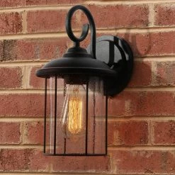 Black Outdoor Wall Lantern Sconce, TORA 1-Light Modern Industrial Cage Outdoor Wall Light with Seeded Glass Shade by Uolfin
