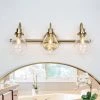 Modern Teardrop Bedroom Wall Light 3-Light Electroplated Brass Dome Bathroom Vanity Light with Clear Glass Shades by Uolfin