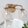 Modern Globe Bathroom Vanity Light 2-Light Brass Gold Round Powder Room Wall Sconce Light with Seeded Glass Shade by Uolfin