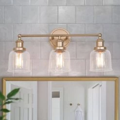 Modern Bell Bathroom Vanity Light Mila 3-Light Brass Gold Circle Powder Room Wall Sconce Light with Clear Glass Shades by Uolfin