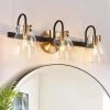 Modern Bathroom Vanity Light, 3-Light Gold and Black Wall Sconce with Clear Glass Shades by Uolfin
