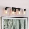 Modern Bell Bathroom vanity Light Firefly 29 in. 4-Light Matte Black Cylinder Wall Sconce Light with Clear Glass Shade by Uolfin